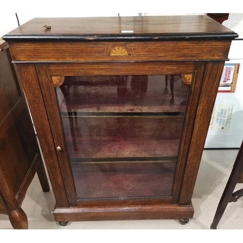 602 - A Victorian rosewood display cabinet with inlaid decoration enclosed by single glazed door