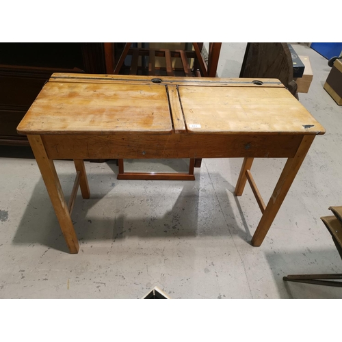 613 - A mid 20th century double school desk with 2 chairs