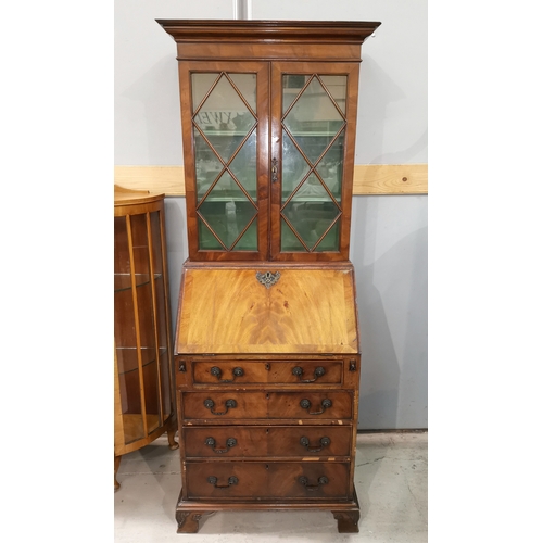 618 - A narrow early 20th century crossbanding figured mahogany bureau bookcase in the Georgian style, the... 