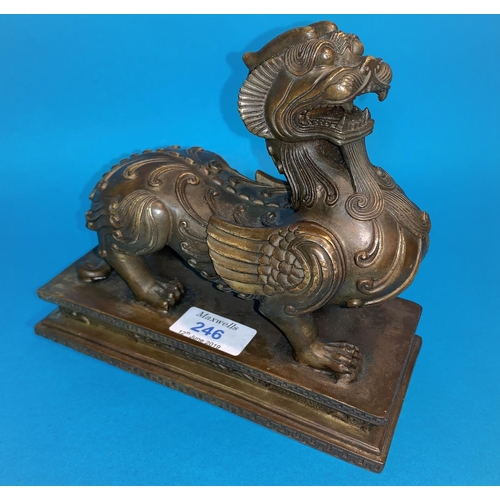 246 - A 19th century Chinese bronze depicting a mythical beast with dog of fo head and dragon legs with sq... 