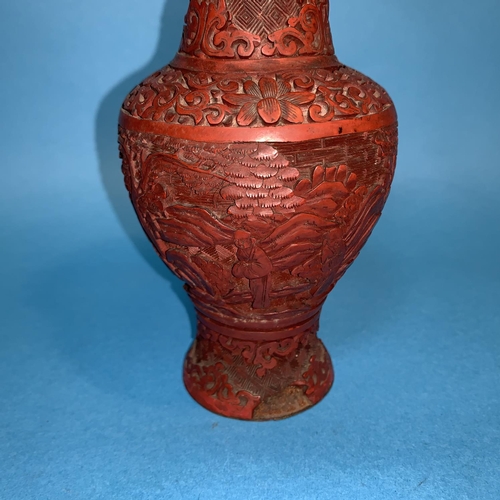 248 - A 19th century Chinese cinabar lacquer baluster vase with relief decoration (lacquer chip to rim and... 