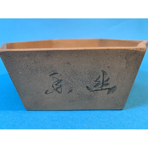 250 - A Chinese Yix sing hexagonal terracotta bowl with relief decoration to sides and seal mark to base d... 