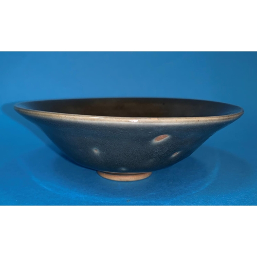 255 - A Chinese flared stone ware bowl under thick dark green glaze diameter 5.5