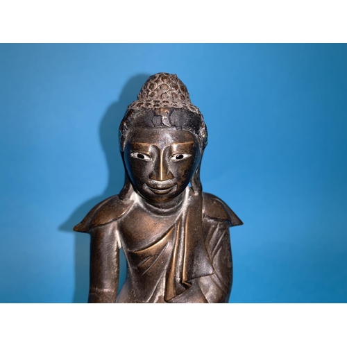 258 - A Burmese bronze seated budda with glass eyes height 6.5