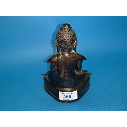 258 - A Burmese bronze seated budda with glass eyes height 6.5