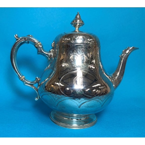 307 - A Victorian silver pear shaped teapot,  with chased decoration, monogrammed, London 1856, 27 oz