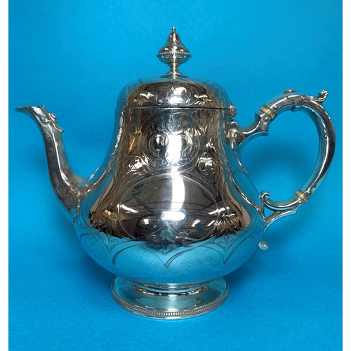 307 - A Victorian silver pear shaped teapot,  with chased decoration, monogrammed, London 1856, 27 oz