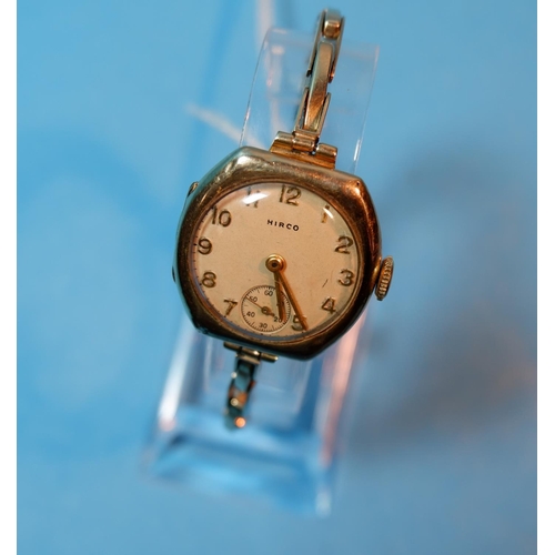 392 - A ladies Hirco 9 carat hallmarked gold wristwatch on expanding strap, stamped '375', 18 gm gross