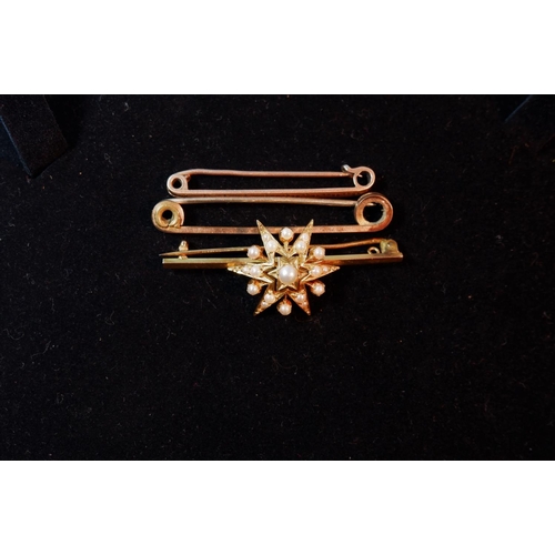 397 - A bar brooch with seed pearl star, stamped '9CT'; a plain bar brooch, stamped '9CT', 6.3 gm; a gold ... 