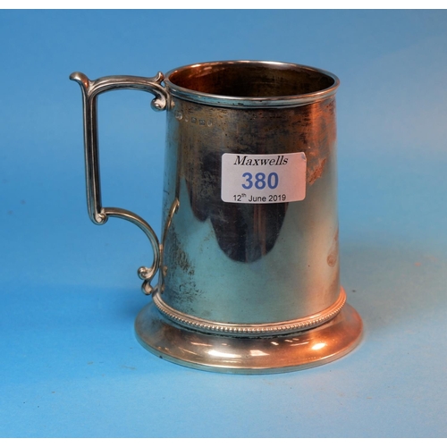 380 - A silver tapering cylindrical 1 pint mug on circular foot, monogrammed, Birmingham 1969, 10 oz
