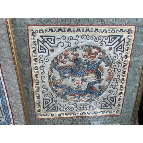 278 - A pair of embroidered silk Chinese panels depicting dragons