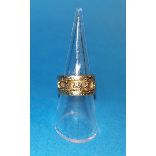393A - A yellow metal wide ring with lettering to the central band, tests as 18c, 8.3gm