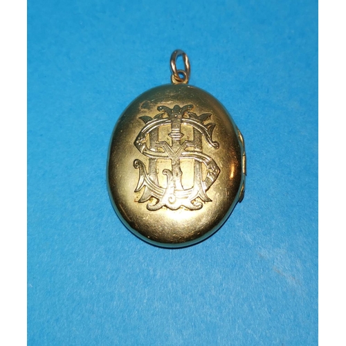 393B - A yellow metal monogrammed locket, unmarked, tests as 14c, gross weight 19.5gm