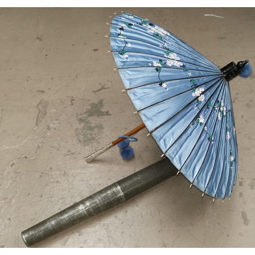 275 - An oriental hand painted parasol in original metal case