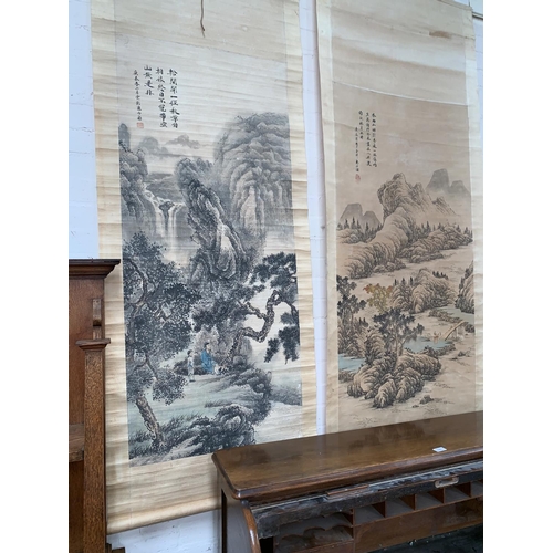 277 - Two early/mid 20th century Chinese scroll pictures depicting figures in landscapes, with Chinese cha... 