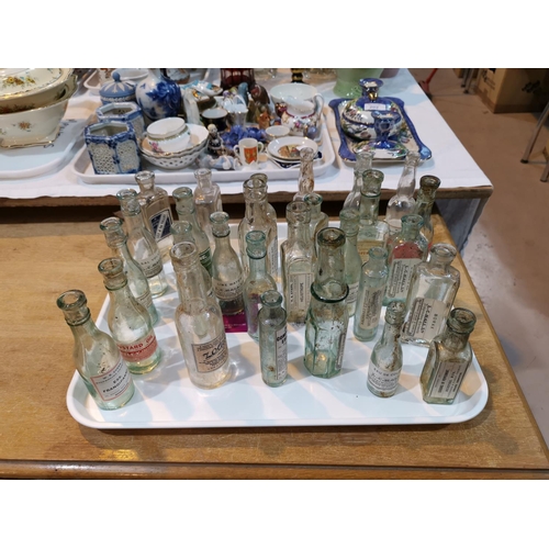 152 - A selection of chemist bottles and labels