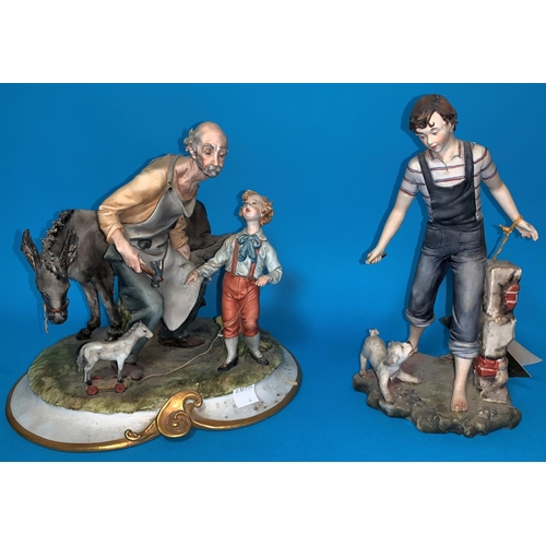4 - A Capodimonte group boy with dog height 9''; a similar group, Old man, donkey and boy height 9''