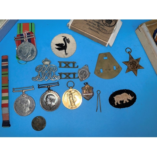 451 - A WWI pair of medals, 22384 Pte. E.E. PICKERING, S. LAN REG, a pair of WWII medals with paperwork, a... 