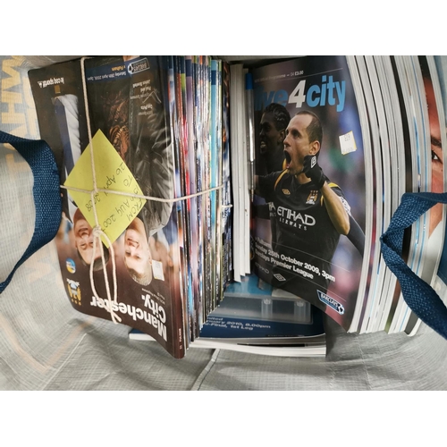 603 - A selection of Manchester City magazines and memorabilia