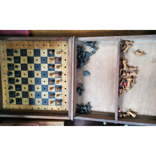 752 - A 19th century travelling chess set with boxwood pieces 24cm and another