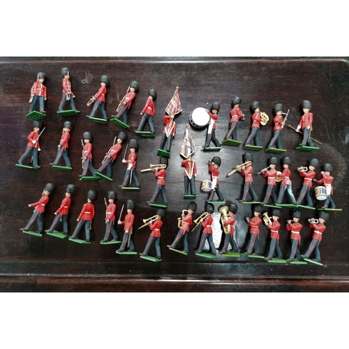 754 - 37 Britains guardsmen comprising 22 Bandsmen and 15 with weapons, 3 Brumm carriages
