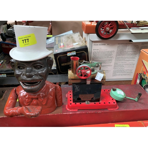 777 - A Mamod stationary steam powered engine and a cast iron money box, man in top hat