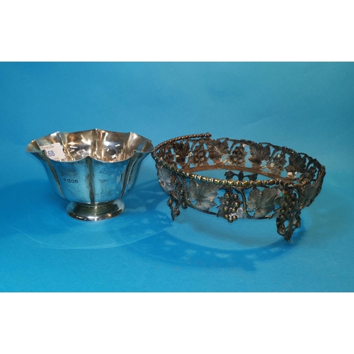 340 - A silver circular lobed bowl with serrated rim, London 102, 6.5 oz; an ornate plated dish stand; A s... 