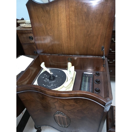 99 - A 1950's Monarch BSR radiogram in burr walnut case