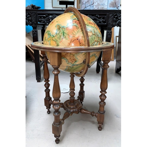 546 - A reproduction globe on stand, with hand painted effect decoration, with zodiac signs to base