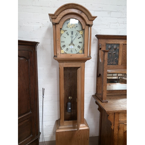 547 - A 19th century pine 30 hour longcase clock with arch top hood and turned pillars, full length door a... 