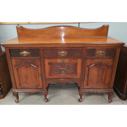 580 - An Edwardian walnut sideboard base with carved and blind fret decoration, 3 frieze drawers and 3 cup... 