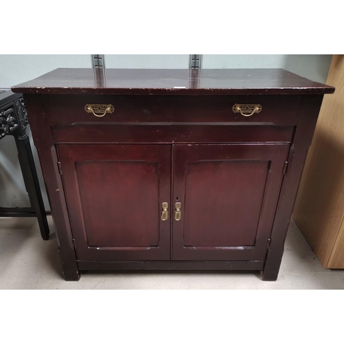 46 - An Edwardian stained pine side cabinet with frieze drawer and double cupboard
