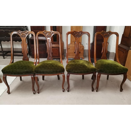 569 - A set of 4 Edwardian carved walnut dining chairs