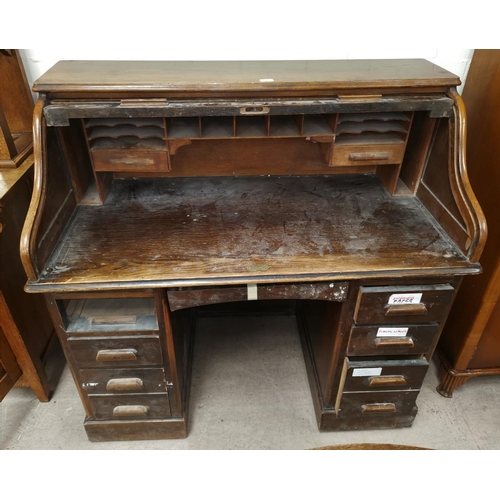 548 - An 'S' roll top twin pedestal desk, vintage oak finish, 48