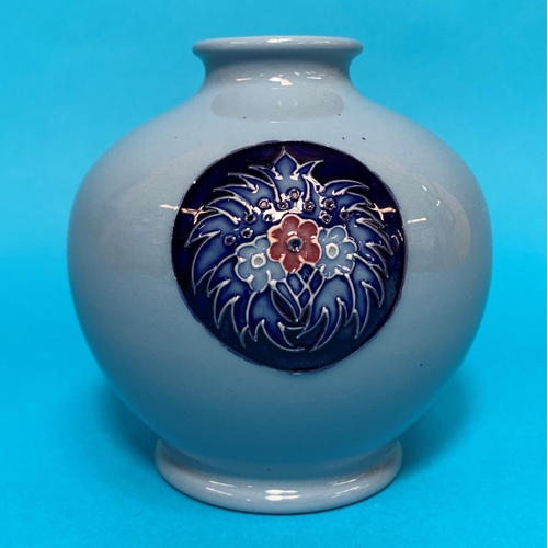 277 - A modern Moorcroft spherical blue vase with circular floral panels signed height 4.5
