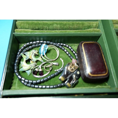 302 - A selection of costume jewellery in leather covered box
