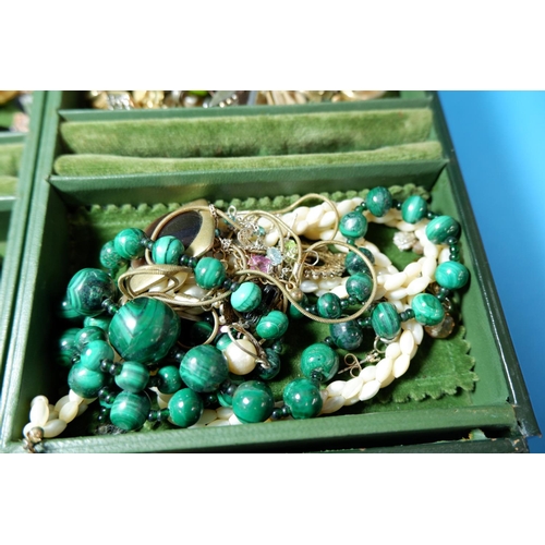 302 - A selection of costume jewellery in leather covered box