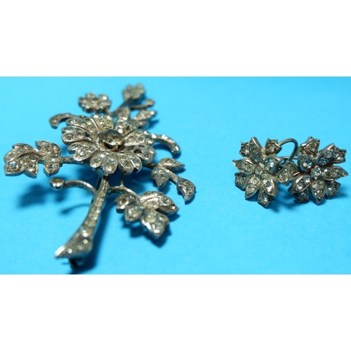 309 - A French floral spray brooch set silver and paste; 2 pairs of similar earrings