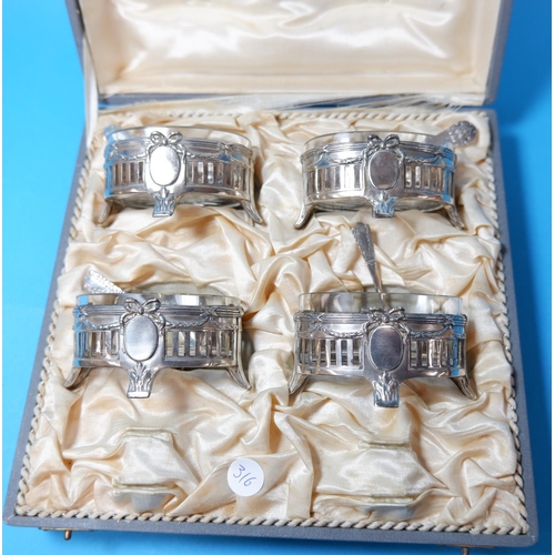 316 - A set of 4 continental secessionist style salts with pierced and embossed decoration and glass liner... 