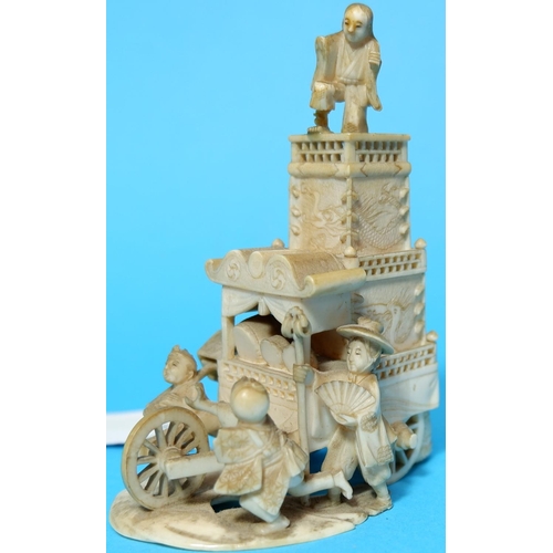 457 - A Japanese Meiji peroid Ivory group of a tall cart with three figures height 9cm