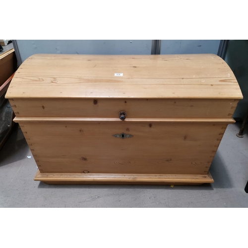 574 - A Victorian large stripped pine blanket box with dome top