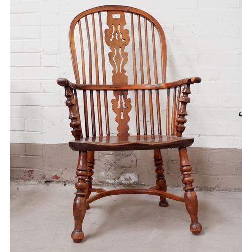 597 - A 19th century high back Windsor chair in yew and elm