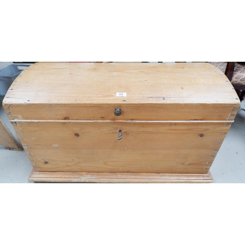 599 - A Victorian stripped pine blanket box with dome top