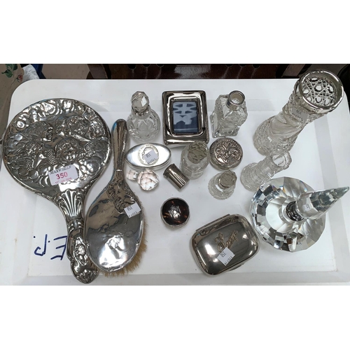 350 - A silver back cherub mirror; an Art Deco slice cut scent bottle with spire stopper; silver mounted t... 
