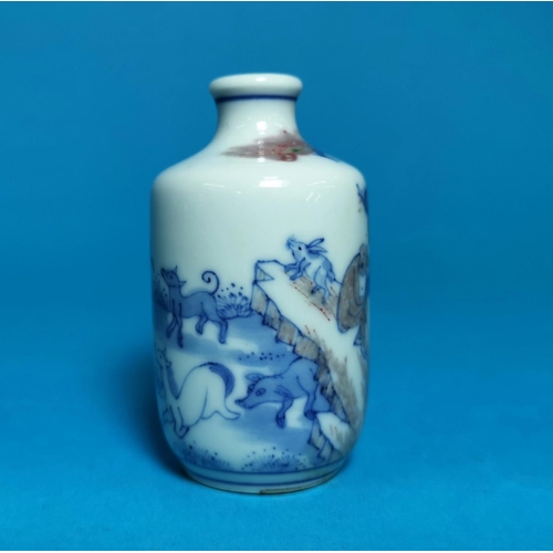 285 - A Chinese porcelain scent bottle decorated in underglaze blue and brown with monkeys, horses, buffal... 