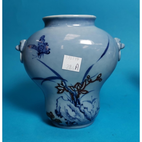 286A - An 18th / 19th century Chinese porcelain teapot decorated in underglaze blue with buildings and tree... 