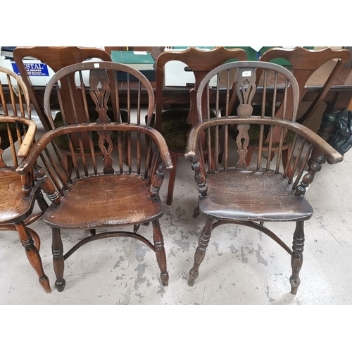 538 - A 19th century near pair of Windsor chairs with low backs and crinoline stretcher