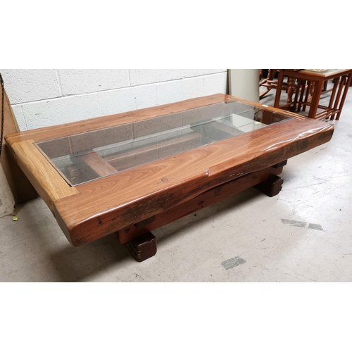 585 - A rustic large heavy coffee table by Jarabosky, with sleepers and glass insert