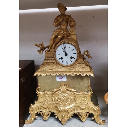 406 - A 19th century French mantel clock in ormolu case surmounted by a reclining man in renaissance dress... 