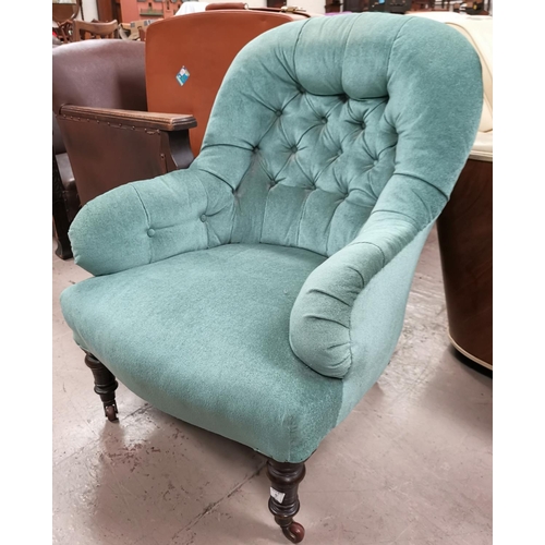 589 - A 19th/20th century low seat armchair, with button back, green upholstery, on turned legs
